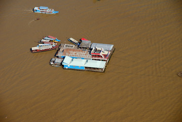 a city on a yellow river in the vicinity of Angkor Watt in Cambodia