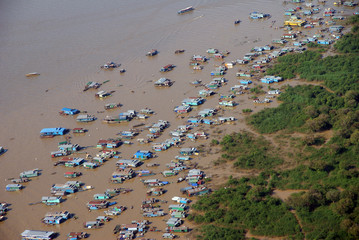a city on a yellow river in the vicinity of Angkor Watt in Cambodia