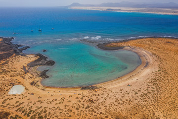 Fototapeta na wymiar The Isla de Lobos in Fuerteventura, Spain with the Playa de la Concha. Aerial drone shot in october 2019