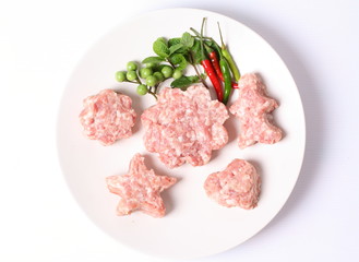 Raw ground meat on white plate for cooking