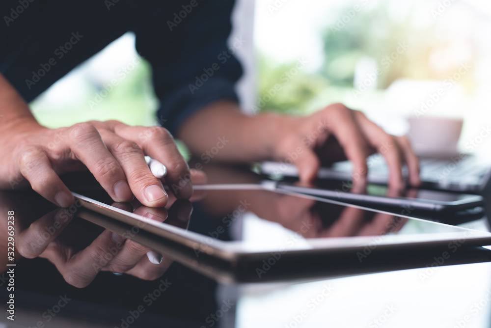Poster working on digital tablet computer