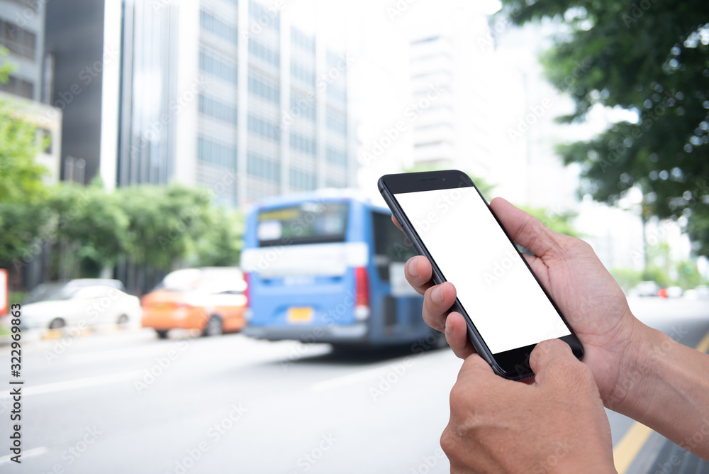 Poster mockup man using mobile phone with traffic background