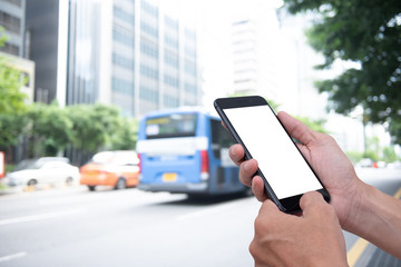 Mockup man using mobile phone with traffic background