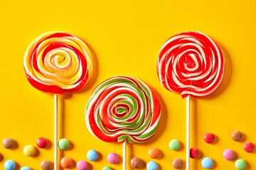 Red themed spiral lollipops on exotic yellow
