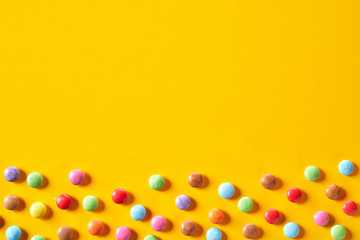 Colorful candy border with sugar-coated chocolate