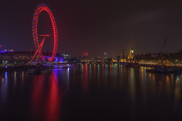 Illuminated London cityscape with River Thames at Night