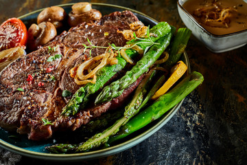 Fresh green asparagus spears served with steak
