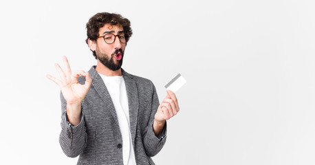 young crazy bearded man with a credit card
