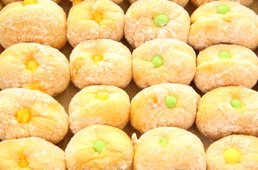 Ready-made donuts covered with powdered sugar on a tray