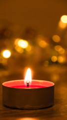 Close up of a burning candle at night; an abstract background of candle