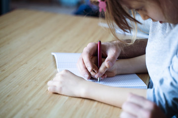 father and daughter doing the homework together