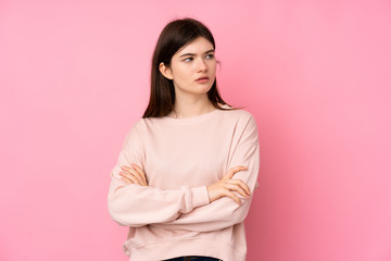 Fototapeta premium Young Ukrainian teenager girl over isolated pink background portrait