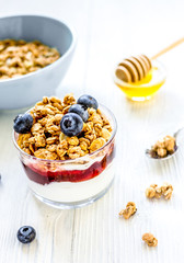 Healthy morning with granola breakfast on white kitchen table