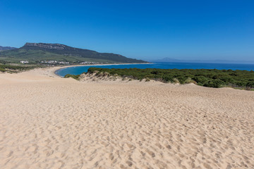 Sunny beach with sand dune, playa de Bolonia, Andalusia, Spain Atlantic coast