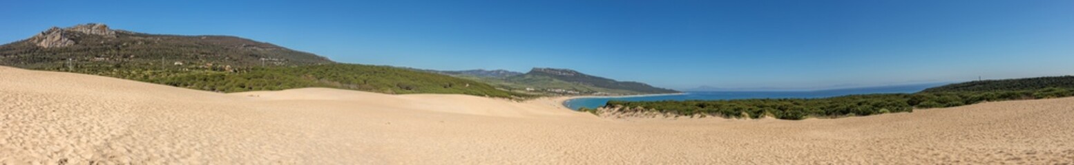 Fototapeta na wymiar Sunny beach with sand dune, playa de Bolonia, Andalusia, Spain Atlantic coast