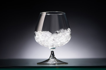 transparent glass with ice in dark with back light