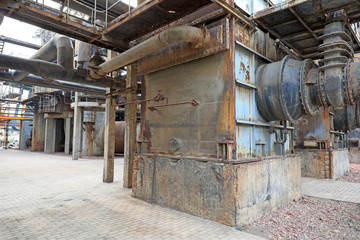 Fototapeta na wymiar Unused and abandoned metal pipes in factories