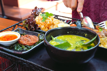 fried fish cake & green curry soup serving with fried rice ฿ sweet & sour pomelo salad