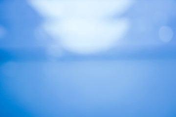 Blurred images that look like water and have indigo bokeh.