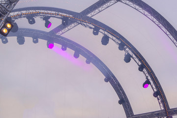 Naklejka premium metal constructions and spotlights on the street stage