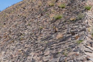 Fragment of the sun pyramid in Teotihuacan. Structure of ancient stones. Travel photo, background, wallpaper, texture. Mexico.