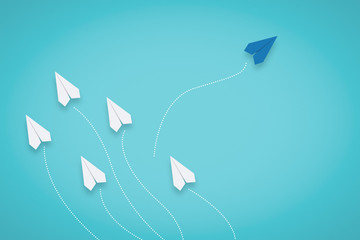 Think Different. Unique Paper Plane Going Different Direction. Business Metaphor.