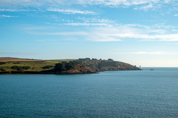 Fototapeta na wymiar The view to St Anthony Head and the lighthouse from St Mawes, Cornwall, UK