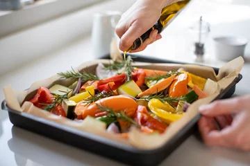 Foto op Plexiglas Close Up Of Seasoning Tray Of Vegetables For Roasting With Olive Oil Ready For Vegan Meal © Daisy Daisy