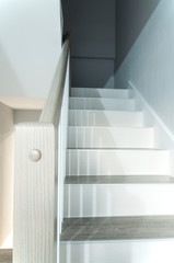 Obraz premium Wooden stylish staircase in the house. Interior.