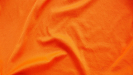 colorful silk cotton background. orange fabric texture