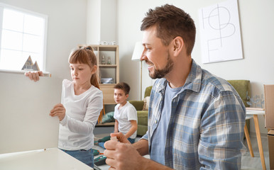 Family assembling furniture at home