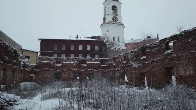clock tower from the window of the destroyed Church, Vyborg, Russia, winter
