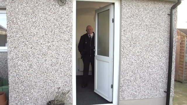 Debt Collector / Bailiff takes TV from house. Repossession. Repo Man. Stock Video Clip Footage. Slow Motion