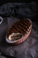 Homemade chocolate tiramisu eaten a little moody food photography