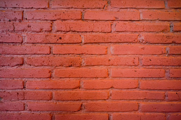 Obraz premium Brick wall orange background with lighting and shadow