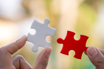 Hand connect white and red jigsaw parts with word problem & solution.   symbol of association and...