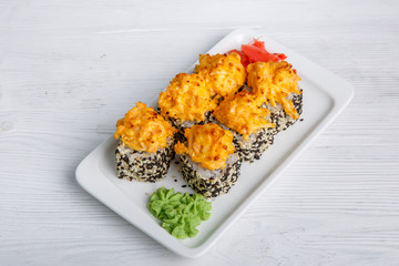 hot sushi rolls with black masago caviar and cheese