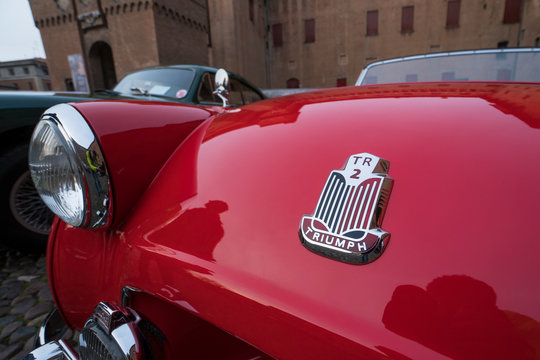Triumph logo emblem on red old TR2 model. Ferrara, Italy, March 25, 2017
