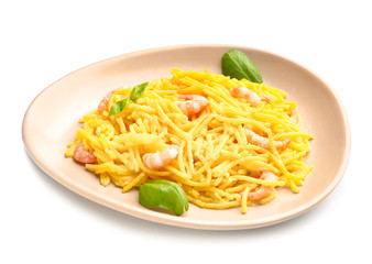 Plate with tasty pasta and shrimps on white background