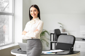 Portrait of young female accountant in office