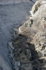 Dam wall with stairs high in the mountain. Dam wall renovation