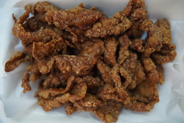 fried chicken peel in white dish