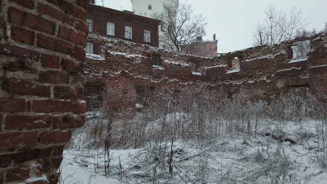 clock tower from the window of the destroyed Church, Vyborg, Russia, winter