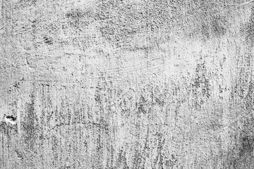 Texture of a concrete wall with cracks and scratches which can be used as a background