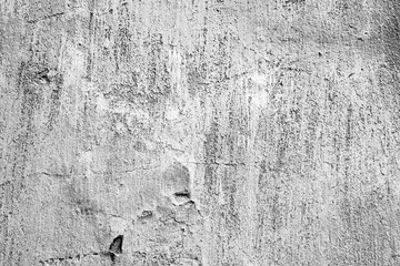 Fototapeta premium Texture of a concrete wall with cracks and scratches which can be used as a background