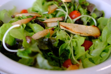 Delicious vegetables salad with slices of grilled mushrooms and vegetables.
