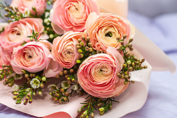 Beautiful wedding bunch with pink roses on table.