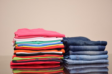 Set of Colorful polo t-shirts and many shades of blue jeans trousers   isolated in style light jeans and dark jeans , Fashion trends of  denim jean pants, fashion tops concept 