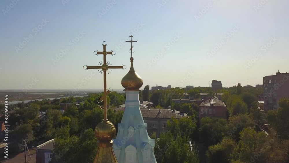 Wall mural The dome of the Church and the cross top view over