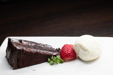 Chocolate cake with ice cream and strawberry